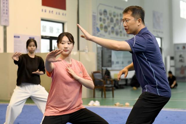 (260719) -- JINAN, July 19, 2026 (Xinhua) -- Zoura Nebulani (C) practices Tai Chi under the guidance of her teacher Li Ning at Rizhao Polytechnic University in Rizhao, east China's Shandong Province, July 16, 2026. Zeela Nebulani and Zoura Nebulani are sisters from Indonesia with ancestral roots in southeast China's Fujian Province. Growing up in a martial arts family, with both of their parents working as professional martial arts coaches, Zeela started martial arts training at the age of 6 and began practicing Tai Chi at 12. 
  In September 2024, Zeela enrolled at Rizhao Polytechnic University in east China's Shandong Province, where she majors in international trade. Inspired by her sister, Zoura enrolled at the same university this year and chose the same major.
   While studying at the university, the sisters not only focus on their academic studies, but also continue their daily martial arts training. In their spare time, they participate in campus cultural performances and exchange activities with young people from China and other countries. They also create bilingual short videos featuring Rizhao's coastal scenery, local folk traditions and daily life, sharing them on Indonesian social media platforms. They introduce Indonesian culture to their teachers and classmates, promoting cultural exchanges between China and Indonesia.
   Zeela and Zoura hope to serve as a cultural bridge between young people in China and Indonesia and contribute to closer friendship between the two countries. (Xinhua/Guo Xulei)