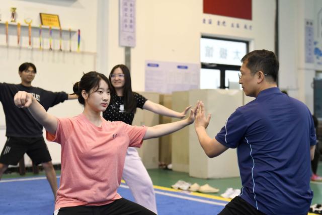 (260719) -- JINAN, July 19, 2026 (Xinhua) -- Zoura Nebulani (L, front) practices Tai Chi under the guidance of her teacher Li Ning at Rizhao Polytechnic University in Rizhao, east China's Shandong Province, July 16, 2026. Zeela Nebulani and Zoura Nebulani are sisters from Indonesia with ancestral roots in southeast China's Fujian Province. Growing up in a martial arts family, with both of their parents working as professional martial arts coaches, Zeela started martial arts training at the age of 6 and began practicing Tai Chi at 12. 
  In September 2024, Zeela enrolled at Rizhao Polytechnic University in east China's Shandong Province, where she majors in international trade. Inspired by her sister, Zoura enrolled at the same university this year and chose the same major.
   While studying at the university, the sisters not only focus on their academic studies, but also continue their daily martial arts training. In their spare time, they participate in campus cultural performances and exchange activities with young people from China and other countries. They also create bilingual short videos featuring Rizhao's coastal scenery, local folk traditions and daily life, sharing them on Indonesian social media platforms. They introduce Indonesian culture to their teachers and classmates, promoting cultural exchanges between China and Indonesia.
   Zeela and Zoura hope to serve as a cultural bridge between young people in China and Indonesia and contribute to closer friendship between the two countries. (Xinhua/Guo Xulei)