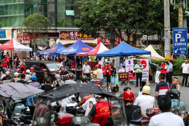 (260719) -- CHONGQING, July 19, 2026 (Xinhua) -- Motorcycle volunteers wait in line at an assembly point to deliver supplies and personnel in Pengshui Miao and Tujia Autonomous County of Chongqing, southwest China, July 19, 2026. A rainfall-induced mountain collapse occurred at 9:08 a.m. on Friday in the Hanjia sub-district of Pengshui, burying more than 10 residential buildings, while leaving some local residents trapped and unaccounted for. 
  China activated a Level-II national emergency response for geological disasters. Multiple rescue forces including emergency response, fire control and public security rushed to the scene and launched full-scale search and rescue operations, while local residents also volunteered to take part in the rescue efforts. (Xinhua/Huang Wei)