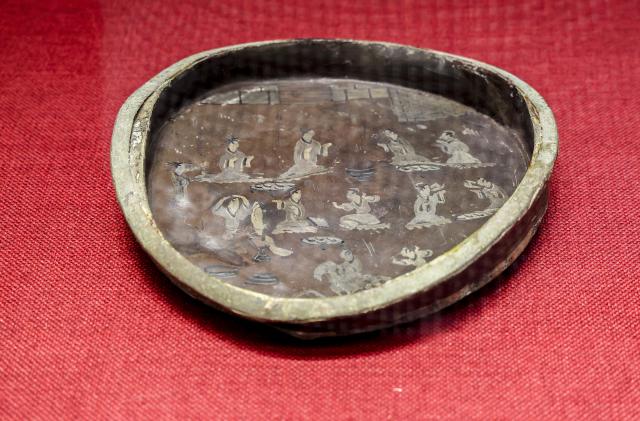 (260719) -- MAANSHAN, July 19, 2026 (Xinhua) -- This photo taken on July 18, 2026 shows a lacquerware displayed at an exhibition on lacquered wooden treasures at the Three Kingdoms Zhu Ran Family Cemetery Museum in Maanshan, east China's Anhui Province.
  The museum currently exhibits rare lacquered wooden treasures unearthed from the tomb of general Zhu Ran in the Eastern Wu Kingdom during the Three Kingdoms period (220-280). Among these masterpieces, lacquered wooden clogs are displayed to the public for the first time since they were excavated more than 40 years ago. (Photo by Wang Wensheng/Xinhua)