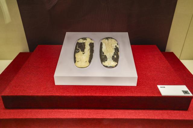 (260719) -- MAANSHAN, July 19, 2026 (Xinhua) -- This photo taken on July 18, 2026 shows lacquered clogs displayed at an exhibition on lacquered wooden treasures at the Three Kingdoms Zhu Ran Family Cemetery Museum in Maanshan, east China's Anhui Province.
  The museum currently exhibits rare lacquered wooden treasures unearthed from the tomb of general Zhu Ran in the Eastern Wu Kingdom during the Three Kingdoms period (220-280). Among these masterpieces, lacquered wooden clogs are displayed to the public for the first time since they were excavated more than 40 years ago. (Photo by Wang Wensheng/Xinhua)