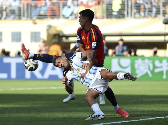 (260720) -- NEW JERSEY, July 20, 2026 (Xinhua) -- Mikel Merino (top) of Spain competes during the final match between Spain and Argentina at the 2026 FIFA World Cup at the New York New Jersey Stadium, the United States, July 19, 2026. (Xinhua/Li Ming)