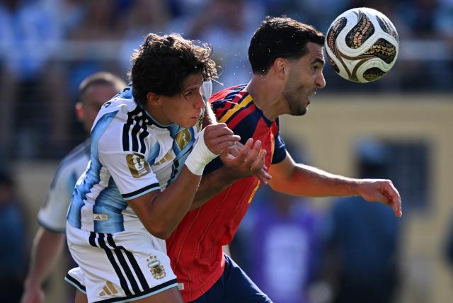 (260720) -- NEW JERSEY, July 20, 2026 (Xinhua) -- Mikel Merino (R) of Spain competes during the final match between Spain and Argentina at the 2026 FIFA World Cup at the New York New Jersey Stadium, the United States, July 19, 2026. (Xinhua/Wu Xiaoling)