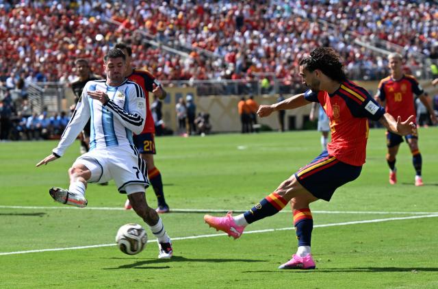 (260720) -- NEW JERSEY, July 20, 2026 (Xinhua) -- Marc Cucurella (R) of Spain shoots during the final match between Spain and Argentina at the 2026 FIFA World Cup at the New York New Jersey Stadium, the United States, July 19, 2026. (Xinhua/Xiao Yijiu)