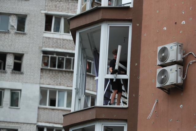 (260720) -- KIEV, July 20, 2026 (Xinhua) -- A resident removes a window damaged in a Russian missile attack in Kiev, Ukraine, July 19, 2026. At least one person was killed and 13 others injured early Sunday in a Russian missile attack on Kiev, said Ukrainian authorities. (Xinhua/Li Dongxu)
