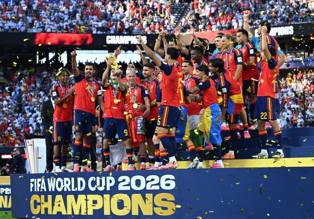 (260720) -- NEW JERSEY, July 20, 2026 (Xinhua) -- Team Spain celebrate during the awarding ceremony after the final match between Spain and Argentina at the 2026 FIFA World Cup at the New York New Jersey Stadium, the United States, July 19, 2026. (Xinhua/Xiao Yijiu)