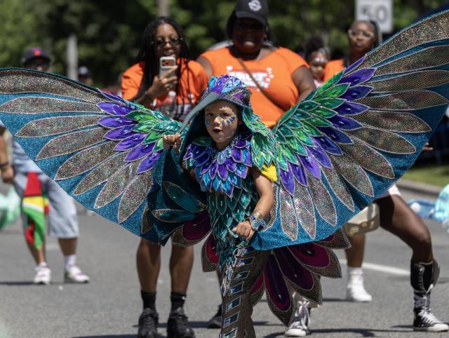 (260720) -- TORONTO, July 20, 2026 (Xinhua) -- A dressed-up boy dances during the Junior Carnival Parade of the 2026 Toronto Caribbean Carnival in Toronto, Canada, on July 19, 2026. Thousands of young participants in vivid costumes took part in the parade, celebrating Caribbean culture through music and dance. (Photo by Zou Zheng/Xinhua)