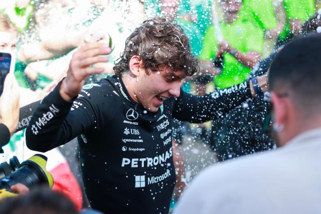 (260720) -- STAVELOT, July 20, 2026 (Xinhua) -- Mercedes' Italian driver Kimi Antonelli celebrates his victory with his team after the Formula One Belgian Grand Prix at the Spa-Francorchamps circuit in Stavelot, Belgium, on July 19, 2026. (Photo by Bao Di/Xinhua)