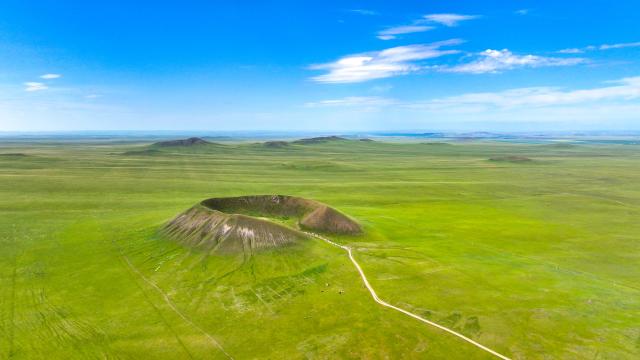 (260720) -- XILINGOL LEAGUE, July 20, 2026 (Xinhua) -- An aerial drone photo taken on July 19, 2026 shows a volcano in a national geopark in Xilingol League, north China's Inner Mongolia Autonomous Region. (Photo by Wang Zheng/Xinhua)