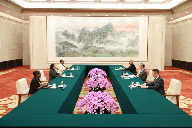 (260720) -- BEIJING, July 20, 2026 (Xinhua) -- Chinese Foreign Minister Wang Yi, also a member of the Political Bureau of the Communist Party of China Central Committee, meets with Carolyn Rodrigues-Birkett, Guyana's permanent representative to the United Nations and a candidate for the next UN secretary-general, in Beijing, capital of China, July 20, 2026. (Xinhua/Wang Ye)