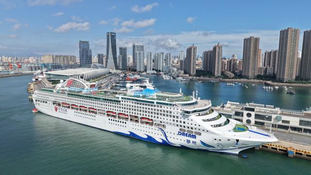 (260720) -- QINGDAO, July 20, 2026 (Xinhua) -- An aerial drone photo taken on July 20, 2026 shows the cruise ship Dream, a maritime sub-venue of the 36th Qingdao International Beer Festival, berthing at Qingdao International Cruise Terminal in Qingdao, east China's Shandong Province. As a part of the 36th Qingdao International Beer Festival, a cruise tour event kicked off at the Qingdao International Cruise Terminal on Monday. Featuring live performances and interactive experiences, this event created an immersive maritime leisure space for visitors. (Xinhua/Li Ziheng)