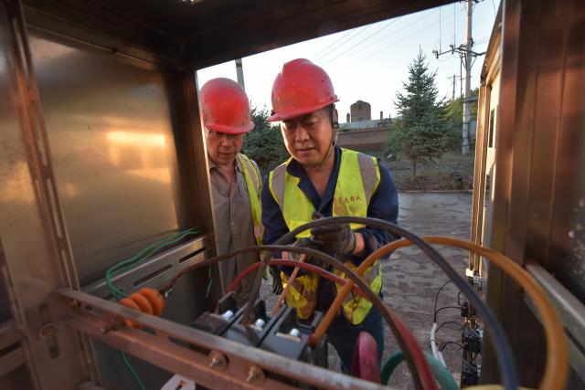 (260720) -- MUDANJIANG, July 20, 2026 (Xinhua) -- Staff members repair water supply facilities in Wenchun Township of Xi'an District, Mudanjiang, northeast China's Heilongjiang Province, July 20, 2026. Water supply and power departments in Mudanjiang have stepped up efforts to restore water and electricity services in the affected areas as flooding gradually recedes in the city. (Photo by Zhang Chunxiang/Xinhua)