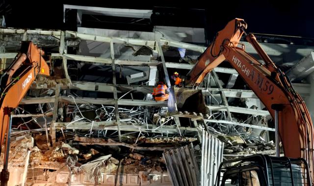 (260721) -- MEDAN, July 21, 2026 (Xinhua) -- This photo provided by Indonesia's National Search and Rescue Agency (Basarnas) Medan shows rescuers working at the scene after a powerful explosion in a residential complex in Medan, North Sumatra, Indonesia, July 21, 2026. A powerful explosion tore through a three-story house in a residential complex in the western Indonesian city of Medan on Monday evening, killing three people and causing extensive damage to surrounding properties, authorities said Tuesday. (Basarnas Medan/Handout via Xinhua)