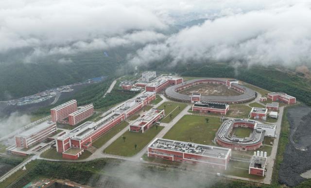 (260721) -- HUIZHOU, July 21, 2026 (Xinhua) -- An aerial drone photo taken on July 20, 2026 shows a view of the site of the High Intensity heavy-ion Accelerator Facility (HIAF) in Huizhou, south China's Guangdong Province. The High Intensity heavy-ion Accelerator Facility (HIAF), a major national science and technology infrastructure project in China, passed its technological acceptance review and entered trial operations on Tuesday in south China's Guangdong Province.
   Located in Guangdong's Huizhou City, the HIAF is a major national sci-tech infrastructure project led by the Institute of Modern Physics (IMP) under the Chinese Academy of Sciences. Construction began in December 2018, with over 6,000 large-scale equipment units, nearly 5 million component parts, and a total pipeline length exceeding 1 million meters.
   Once fully operational, the HIAF will provide heavy ion beams with the world's highest pulse intensity and the most precise multi-functional nuclear mass spectrometer. It will serve as a leading global research platform for exploring atomic nuclei limits, unraveling nuclear astrophysical processes, advancing nuclear energy development, and enabling multidisciplinary applications. (Xinhua/Deng Hua)