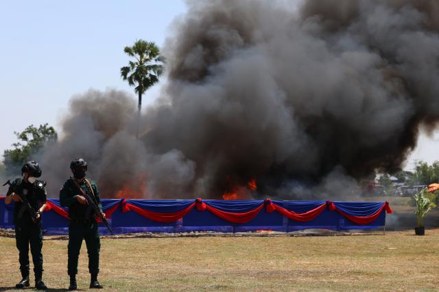 (260721) -- KANDAL, July 21, 2026 (Xinhua) -- Anti-drug police officers stand guard during a drug-burning ceremony in Kandal province, Cambodia, July 21, 2026. Cambodia destroyed 5.62 tons of illicit drugs and precursor chemicals valued at 500 million U.S. dollars on Tuesday, Deputy Prime Minister and Interior Minister Sar Sokha said. (Photo by Sovannara/Xinhua)