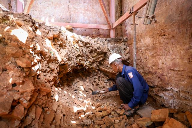 (260721) -- SIEM REAP, July 21, 2026 (Xinhua) -- A staff member works at the restoration site of a Bakong temple's tower in Siem Reap province, Cambodia, on July 10, 2026. Archaeologists are restoring the millennium-old brick towers of Bakong temple in Cambodia's Angkor Archaeological Park, the APSARA National Authority (ANA) said on Tuesday. (ANA/Handout via Xinhua)