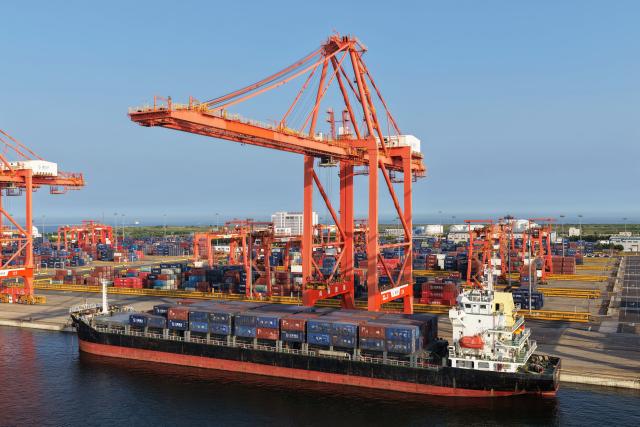 (260722) -- TANGSHAN, July 22, 2026 (Xinhua) -- An aerial drone photo taken on July 21, 2026 shows a vessel loading containers at the Jingtang area of Tangshan Port in Tangshan, north China's Hebei Province. Cargo throughput of Tangshan Port reached 445.56 million tonnes in the first half of 2026, up 2.77 percent year on year, according to local port administration. (Xinhua/Yang Shiyao)