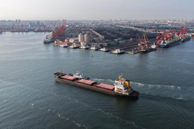 (260722) -- TANGSHAN, July 22, 2026 (Xinhua) -- An aerial drone photo taken on July 21, 2026 shows a vessel sailing toward the Jingtang area of Tangshan Port in Tangshan, north China's Hebei Province. Cargo throughput of Tangshan Port reached 445.56 million tonnes in the first half of 2026, up 2.77 percent year on year, according to local port administration. (Xinhua/Yang Shiyao)