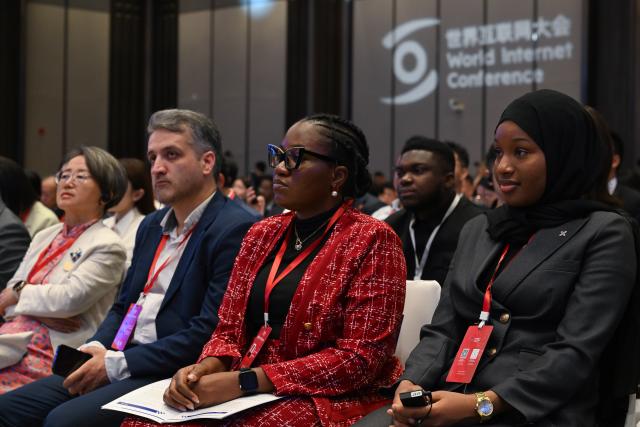 (260722) -- XI'AN, July 22, 2026 (Xinhua) -- Participants are pictured during the opening ceremony of the 2026 World Internet Conference Digital Silk Road Development Forum in Xi'an, northwest China's Shaanxi Province, July 22, 2026. Themed on "Pooling Intelligence on the Silk Road, Embarking on a Digital Future -- Jointly Building a Community with a Shared Future in Cyberspace," the forum opened here on Wednesday, and attracted approximately 800 participants from over 50 countries and regions, as well as seven international organizations. (Xinhua/Zou Jingyi)