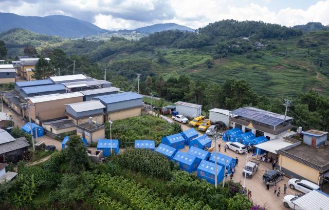 (260722) -- MOJIANG, July 22, 2026 (Xinhua) -- A drone photo shows a view of a temporary shelter at Jingping Village in Yutang Town of Mojiang Hani Autonomous County, southwest China's Yunnan Province, on July 22, 2026. The Yunnan provincial earthquake relief headquarters has activated a Level-IV emergency response after a 5.0-magnitude earthquake jolted Mojiang on Tuesday, local authorities said.
   No casualties have been reported so far. (Xinhua/Chen Xinbo)