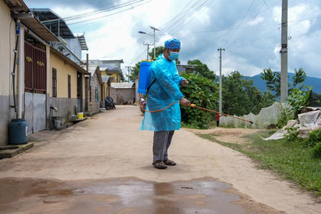 (260722) -- MOJIANG, July 22, 2026 (Xinhua) -- A staff member from local center for disease control and prevention carries out disinfection at a temporary shelter at Jingping Village in Yutang Town of Mojiang Hani Autonomous County, southwest China's Yunnan Province, on July 22, 2026. The Yunnan provincial earthquake relief headquarters has activated a Level-IV emergency response after a 5.0-magnitude earthquake jolted Mojiang on Tuesday, local authorities said.
   No casualties have been reported so far. (Xinhua/Chen Xinbo)