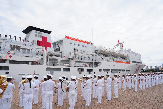(260722) -- QINGDAO, July 22, 2026 (Xinhua) -- The Chinese People's Liberation Army (PLA) Navy hospital ship, Auspicious Ark, departs from a port in Qingdao, east China's Shandong Province, on July 22, 2026. The Chinese navy hospital ship departed from a port in Qingdao on Wednesday for a humanitarian medical service mission in Africa and South Asia. (Photo by Liu Zaiyao/Xinhua)