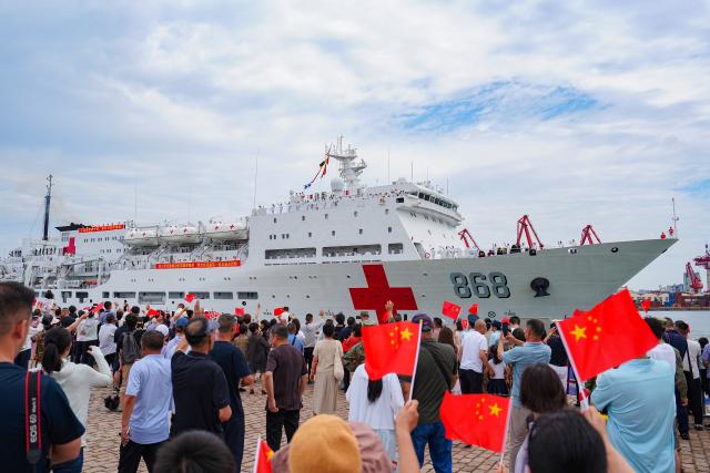 (260722) -- QINGDAO, July 22, 2026 (Xinhua) -- The Chinese People's Liberation Army (PLA) Navy hospital ship, Auspicious Ark, departs from a port in Qingdao, east China's Shandong Province, on July 22, 2026. The Chinese navy hospital ship departed from a port in Qingdao on Wednesday for a humanitarian medical service mission in Africa and South Asia. (Photo by Liu Zaiyao/Xinhua)