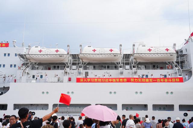 (260722) -- QINGDAO, July 22, 2026 (Xinhua) -- The Chinese People's Liberation Army (PLA) Navy hospital ship, Auspicious Ark, departs from a port in Qingdao, east China's Shandong Province, on July 22, 2026. The Chinese navy hospital ship departed from a port in Qingdao on Wednesday for a humanitarian medical service mission in Africa and South Asia. (Photo by Liu Zaiyao/Xinhua)