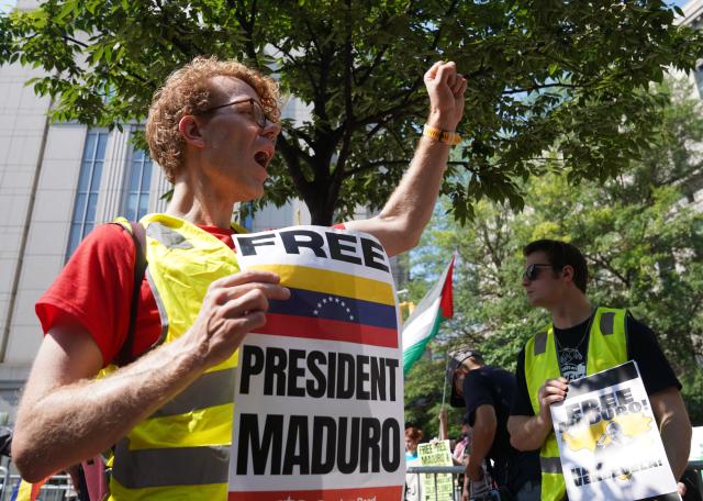(260722) -- NEW YORK, July 22, 2026 (Xinhua) -- Supporters of Venezuelan President Nicolas Maduro protest outside a courthouse in New York, the United States, July 22, 2026. Venezuelan President Nicolas Maduro and his wife Cilia Flores will go on trial starting on June 1, 2027, a U.S. judge ruled on Wednesday.
The couple, who pleaded not guilty to drug trafficking and firearms charges, made their third appearance in a New York court after the forcible seizure by U.S. troops in a military raid in early January. (Xinhua/Zhang Fengguo)