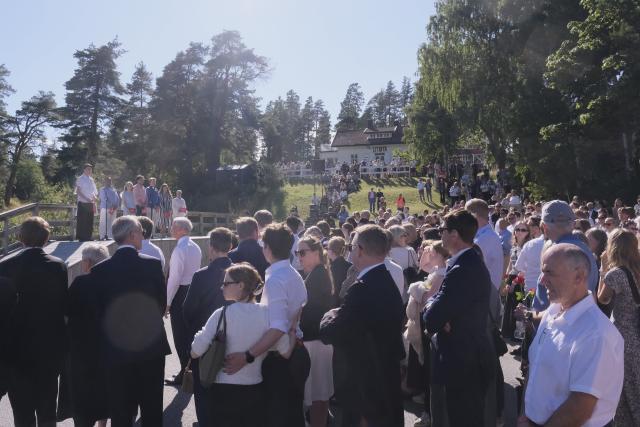 (260722) -- UTOYA, July 22, 2026 (Xinhua) -- People attend a name-reading and wreath-laying ceremony on Utoya Island, Norway, July 22, 2026. Norwegian Prime Minister Jonas Gahr Store on Wednesday warned of the growing threat of far-right radicalization among young people, saying social media, artificial intelligence and social isolation were fueling extremism, as the country marked the 15th anniversary of the July 22, 2011 terror attacks. (Xinhua/Zhang Yuliang)