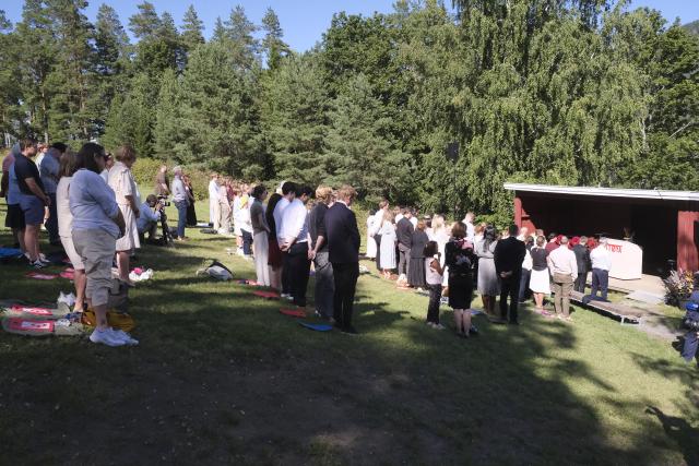 (260722) -- UTOYA, July 22, 2026 (Xinhua) -- People observe a moment of silence during a memorial event marking the 15th anniversary of the July 22, 2011 terror attacks on Utoya Island, Norway, July 22, 2026. Norwegian Prime Minister Jonas Gahr Store on Wednesday warned of the growing threat of far-right radicalization among young people, saying social media, artificial intelligence and social isolation were fueling extremism, as the country marked the 15th anniversary of the July 22, 2011 terror attacks. (Xinhua/Zhang Yuliang)