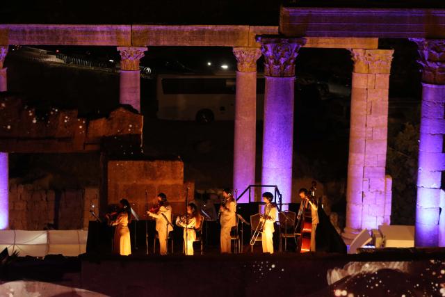 (260722) -- JERASH, July 22, 2026 (Xinhua) -- Artists perform at a theater of Jerash archaeological site during the 40th Jerash Festival for Culture and Arts in Jerash, Jordan, July 22, 2026. Jordan's Jerash Festival for Culture and Arts will mark its 40th edition from July 22 to Aug. 2, turning the ancient Roman city of Jerash into a vibrant hub for cultural exchange, artistic expression and civilizational dialogue. (Photo by Mohammad Abu Ghosh/Xinhua)