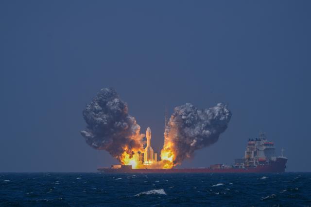 (260723) -- BEIJING, July 23, 2026 (Xinhua) -- A Gravity-1 carrier rocket carrying nine satellites blasts off from waters off the coast of Shanghai, east China, July 22, 2026. The Taiyuan Satellite Launch Center launched the commercial rocket at 10:54 a.m. (Beijing Time) on Wednesday, placing nine satellites into their designated orbits. (Photo by Song Xiongye/Xinhua)