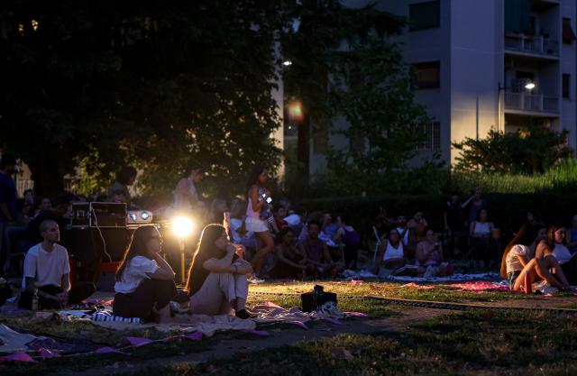 (260723) -- ROME, July 23, 2026 (Xinhua) -- People watch a film during the summer edition of the Cinema Alle Mura festival in front of the ancient Aurelian Walls Park in Rome, Italy, July 22, 2026. (Xinhua/Wang Kaiyan)
