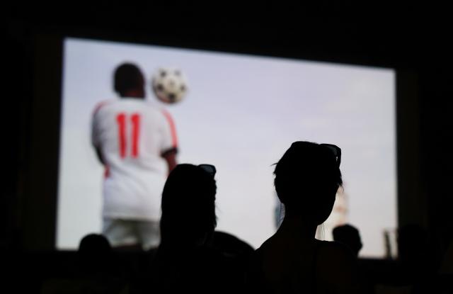(260723) -- ROME, July 23, 2026 (Xinhua) -- People watch a film during the summer edition of the Cinema Alle Mura festival in front of the ancient Aurelian Walls Park in Rome, Italy, July 22, 2026. (Xinhua/Wang Kaiyan)