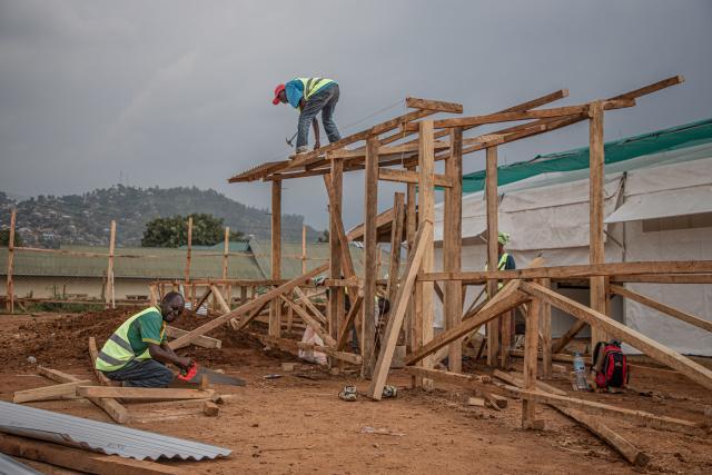 (260723) -- KINSHASA, July 23, 2026 (Xinhua) -- Workers build an Ebola treatment center in Beni territory of North Kivu Province, the Democratic Republic of the Congo (DRC), on July 22, 2026. Over two months, the fastest-in-the-world Ebola outbreak in the Democratic Republic of the Congo (DRC) has left more than 1,000 dead. (Xinhua)