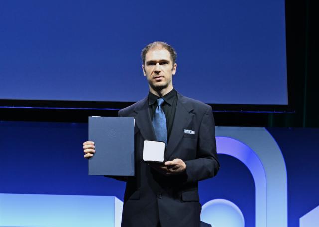 (260723) -- PHILADELPHIA, July 23, 2026 (Xinhua) -- American mathematician John Pardon is awarded the Fields Medal at the opening ceremony of the 2026 International Congress of Mathematicians in Philadelphia, the United States, on July 23, 2026. (Xinhua/Li Rui)