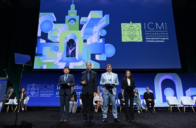 (260723) -- PHILADEPHIA, July 23, 2026 (Xinhua) -- Fields Medalists Deng Yu (1st L) and Wang Hong (1st R), both Chinese mathematicians, John Pardon (2nd L), an American mathematician, and Jacob Tsimerman, a Canadian mathematician, pose for a group photograph at the opening ceremony of the 2026 International Congress of Mathematicians in Philadelphia, the United States, July 23, 2026. Chinese mathematicians Deng Yu and Wang Hong were awarded the Fields Medals at the opening ceremony of the 2026 International Congress of Mathematicians held here on Thursday, marking the first time Chinese mathematicians have won the prestigious honor. The other recipients of the 2026 Fields Medals are American John Pardon and Canada's Jacob Tsimerman. (Xinhua/Li Rui)