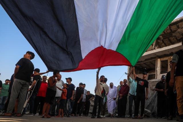 (260723) -- GAZA, July 23, 2026 (Xinhua) -- Palestinians take part in a march to protest against Israeli plans for forced displacement in Gaza City, July 23, 2026. (Photo by Rizek Abdeljawad/Xinhua)