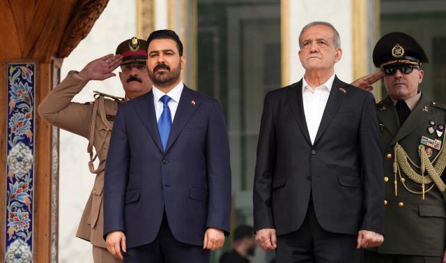 (260723) -- TEHRAN, July 23, 2026 (Xinhua) -- Iranian President Masoud Pezeshkian (R) meets with visiting Iraqi Prime Minister Ali al-Zaidi in Tehran, Iran, on July 23, 2026. (Iraqi Prime Minister Media Office/Handout via Xinhua)