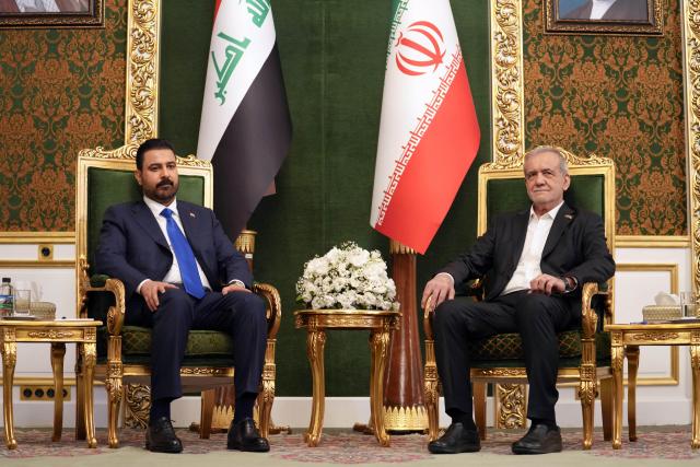 (260723) -- TEHRAN, July 23, 2026 (Xinhua) -- Iranian President Masoud Pezeshkian (R) meets with visiting Iraqi Prime Minister Ali al-Zaidi in Tehran, Iran, on July 23, 2026. (Iraqi Prime Minister Media Office/Handout via Xinhua)