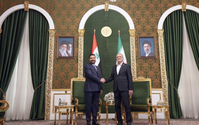 (260723) -- TEHRAN, July 23, 2026 (Xinhua) -- Iranian President Masoud Pezeshkian (R) meets with visiting Iraqi Prime Minister Ali al-Zaidi in Tehran, Iran, on July 23, 2026. (Iraqi Prime Minister Media Office/Handout via Xinhua)