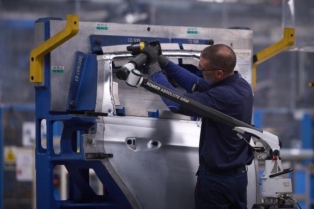(260723) -- VALENCIA, July 23, 2026 (Xinhua) -- An employee work in a Ford factory in Valencia, Spain, July 23, 2026. Geely Automobile Holdings and Ford Motor Company on Thursday announced a deal to produce new energy vehicles for the European market at Ford's manufacturing plant in Valencia, Spain. (Photo by Pablo Morano/Xinhua)