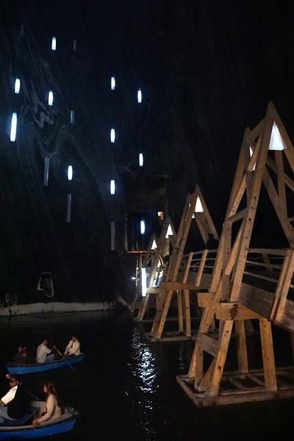 (260724) -- TURDA, July 24, 2026 (Xinhua) -- Visitors row boats in an underground lake at a defunct salt mine in Turda, Romania, on July 23, 2026. As a new heat wave sweeps across Europe, the defunct salt mine in Turda has become a popular retreat for visitors seeking to escape the summer heat.
   Featuring recreational facilities such as rowboats, a Ferris wheel and billiard tables, the salt mine maintains a year-round temperature of around 10 to 12 degrees Celsius. (Xinhua/Yao Yulin)