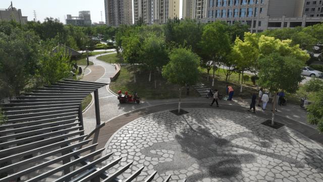 (260724) -- LANZHOU, July 24, 2026 (Xinhua) -- An aerial drone photo taken on July 24, 2026 shows a view of a pocket park of the Dong'an community in Jiayuguan City, northwest China's Gansu Province. (Photo by Li Wei/Xinhua)