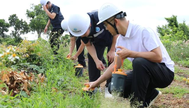 (260724) -- HAIKOU, July 24, 2026 (Xinhua) -- Researchers work at the Qiongbei volcano, part of the Leiqiong volcanic field, in Haikou, south China's Hainan Province, July 2, 2026. TO GO WITH "China Focus: Scientists search for answers to moon living in south China lava caves" (Xinhua)
