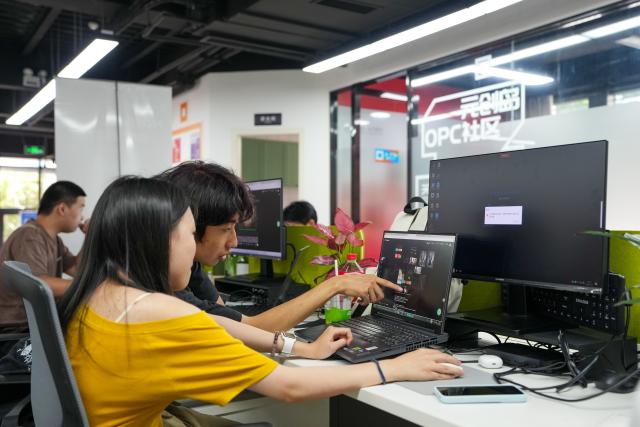(260724) -- CHENGDU, July 24, 2026 (Xinhua) -- People communicate on short dramas production at a service platform for OPCs (One-Person Company) in Tianfu Long Island Digital Cultural and Creative Park in Chengdu, southwest China's Sichuan Province, on July 22, 2026. An OPC refers to a business form where individuals can complete the full closed commercial loop from product R&D to market launch with the support of AI tools. The animated film "All Wishes Come True" released nationwide recently has won praise for its fresh take on Chinese mythology and stunning visual effects. Following the resounding success of animation film series of "Ne Zha," it is another blockbuster developed at Tianfu Long Island Digital Cultural and Creative Park under the Chengdu High-Tech Industrial Development Zone. 
   The park is home to more than 70 digital cultural and creative enterprises covering sectors such as animation, game development and esports. The Chengdu High-Tech Industrial Development Zone, for its part, now hosts more than 6,000 companies in the digital cultural and creative industry, reflecting the city's rapidly growing creative economy. (Xinhua/Xu Bingjie)