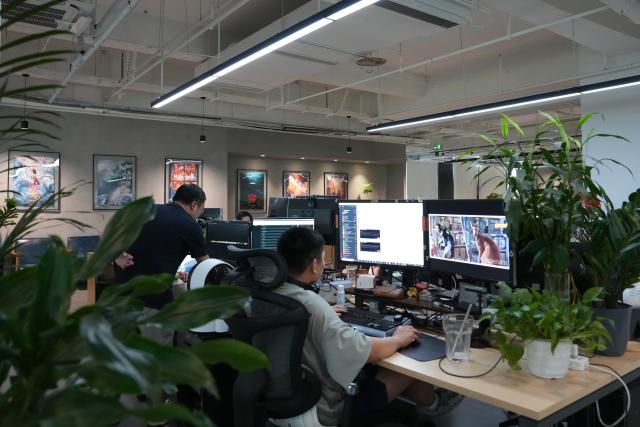 (260724) -- CHENGDU, July 24, 2026 (Xinhua) -- A post producer works at a studio in Tianfu Long Island Digital Cultural and Creative Park in Chengdu, southwest China's Sichuan Province, on July 22, 2026. The animated film "All Wishes Come True" released nationwide recently has won praise for its fresh take on Chinese mythology and stunning visual effects. Following the resounding success of animation film series of "Ne Zha," it is another blockbuster developed at Tianfu Long Island Digital Cultural and Creative Park under the Chengdu High-Tech Industrial Development Zone. 
   The park is home to more than 70 digital cultural and creative enterprises covering sectors such as animation, game development and esports. The Chengdu High-Tech Industrial Development Zone, for its part, now hosts more than 6,000 companies in the digital cultural and creative industry, reflecting the city's rapidly growing creative economy. (Xinhua/Xu Bingjie)