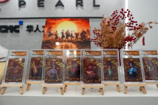 (260724) -- CHENGDU, July 24, 2026 (Xinhua) -- This photo taken on July 23, 2026 shows cultural and creative products based on "All Wishes Come True" at a studio in Tianfu Long Island Digital Cultural and Creative Park in Chengdu, southwest China's Sichuan Province. The animated film "All Wishes Come True" released nationwide recently has won praise for its fresh take on Chinese mythology and stunning visual effects. Following the resounding success of animation film series of "Ne Zha," it is another blockbuster developed at Tianfu Long Island Digital Cultural and Creative Park under the Chengdu High-Tech Industrial Development Zone. 
   The park is home to more than 70 digital cultural and creative enterprises covering sectors such as animation, game development and esports. The Chengdu High-Tech Industrial Development Zone, for its part, now hosts more than 6,000 companies in the digital cultural and creative industry, reflecting the city's rapidly growing creative economy. (Xinhua/Xu Bingjie)