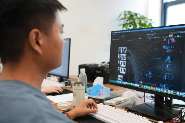(260724) -- CHENGDU, July 24, 2026 (Xinhua) -- An employee works at a studio in Tianfu Long Island Digital Cultural and Creative Park in Chengdu, southwest China's Sichuan Province, on July 22, 2026. The animated film "All Wishes Come True" released nationwide recently has won praise for its fresh take on Chinese mythology and stunning visual effects. Following the resounding success of animation film series of "Ne Zha," it is another blockbuster developed at Tianfu Long Island Digital Cultural and Creative Park under the Chengdu High-Tech Industrial Development Zone. 
   The park is home to more than 70 digital cultural and creative enterprises covering sectors such as animation, game development and esports. The Chengdu High-Tech Industrial Development Zone, for its part, now hosts more than 6,000 companies in the digital cultural and creative industry, reflecting the city's rapidly growing creative economy. (Xinhua/Xu Bingjie)